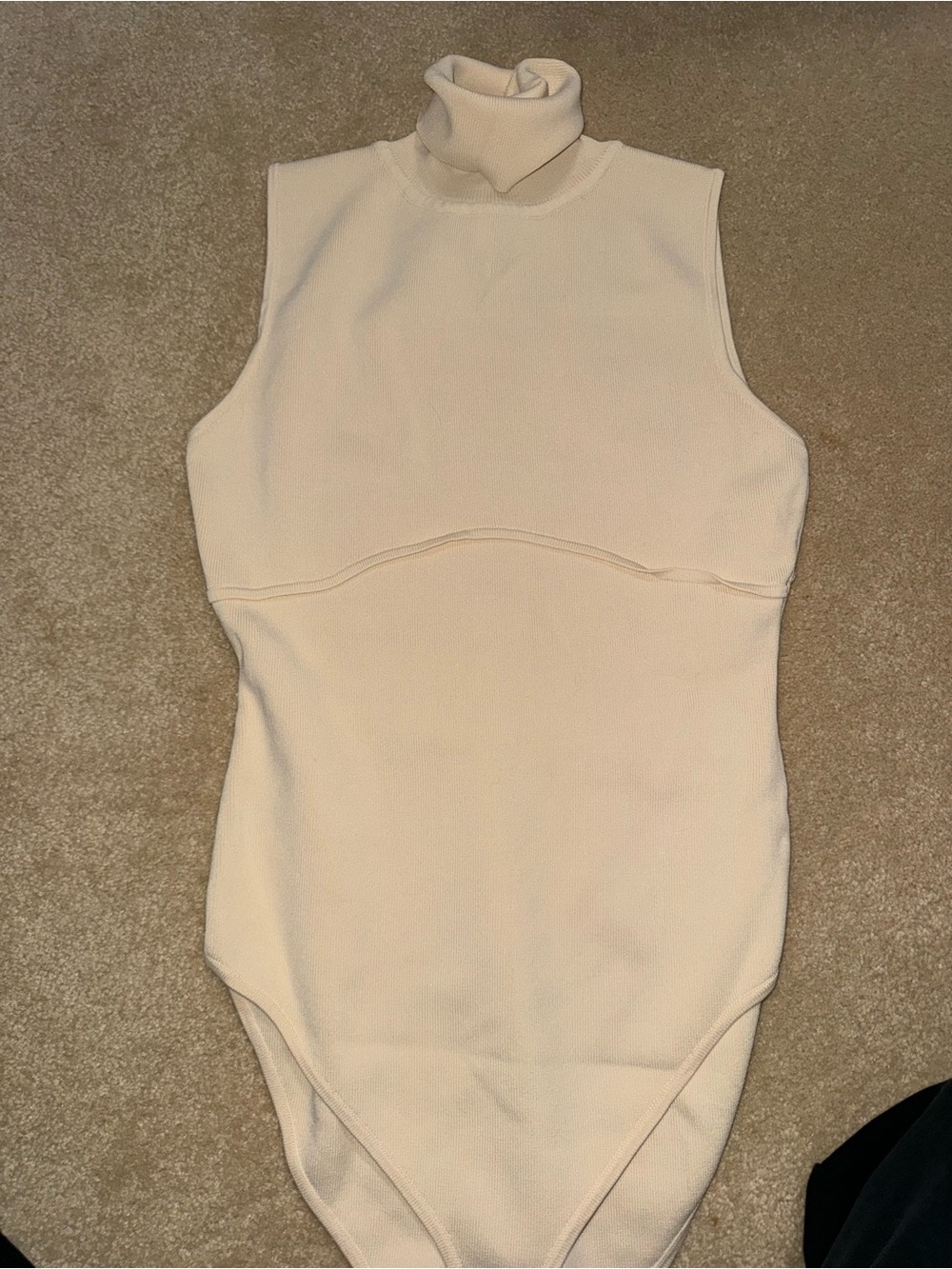 Ribbed Sleeveless Turtleneck One-Piece Bodysuit in Cream